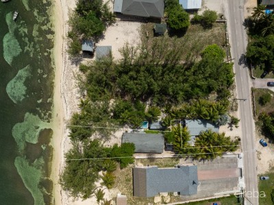 SANDY BEACHFRONT LAND WITH FIXER UPPER COTTAGE