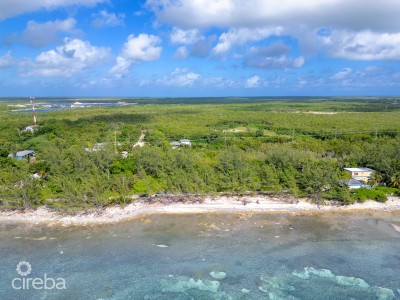 TRANQUIL BEACHFRONT ACRE PARCEL- REEF PROTECTED WITH WHITE SAND